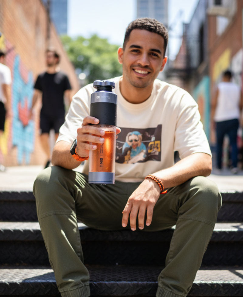 Bottle held in hand outdoors